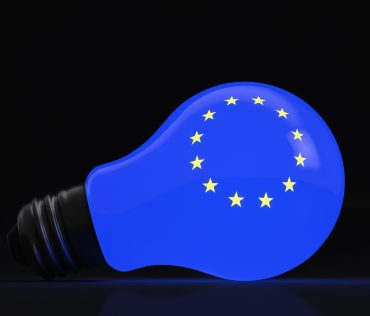 Glowing light bulb with european union symbols